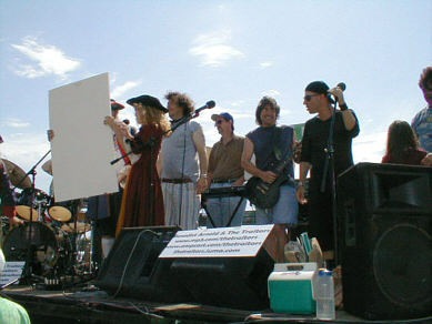 The Traitors play live on a flatbed truck, through a solar powered PA, in an anti-fraudulent energy crisis, anti-Bush demonstration, Long Beach CA, July 4, 2001 - CLICK FOR NEXT IMAGE